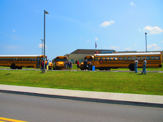 Four new yellow chool buses